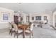 Bright dining room adjacent to living area with large windows at 11175 N 121St Way, Scottsdale, AZ 85259
