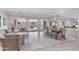 Open floor plan with dining area, large windows, and tiled floor at 11175 N 121St Way, Scottsdale, AZ 85259