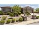 Single-story home with landscaped front yard, two-car garage, and desert landscaping at 11175 N 121St Way, Scottsdale, AZ 85259