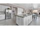 Modern kitchen with large island, stainless steel appliances, and granite countertops at 11175 N 121St Way, Scottsdale, AZ 85259