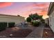 Well-maintained backyard featuring a patio, seating area, and lush greenery at 12942 W Sola Dr, Sun City West, AZ 85375