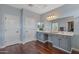 Well-lit bathroom boasts a spacious vanity with ample storage and a large mirror creating an open feel at 12942 W Sola Dr, Sun City West, AZ 85375