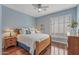 Inviting bedroom with light wood accents, window shutters and natural light, creating a comfortable and serene atmosphere at 12942 W Sola Dr, Sun City West, AZ 85375