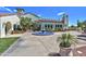 Charming clubhouse with a terracotta roof, water feature, and meticulously manicured landscaping at 12942 W Sola Dr, Sun City West, AZ 85375