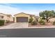 Inviting one-story home showcasing desert landscaping, a wide driveway, and a terracotta-tiled roof at 12942 W Sola Dr, Sun City West, AZ 85375