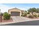 Attractive one-story house featuring a large garage, desert landscaping, and a private driveway at 12942 W Sola Dr, Sun City West, AZ 85375