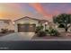 Charming single-story home featuring a tile roof, desert landscaping, and a spacious attached two-car garage at 12942 W Sola Dr, Sun City West, AZ 85375