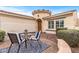 Charming front yard featuring desert landscaping and a quaint patio with outdoor seating at 12942 W Sola Dr, Sun City West, AZ 85375