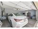 Well-lit garage featuring parking space for two cars, including a sleek white sedan at 12942 W Sola Dr, Sun City West, AZ 85375