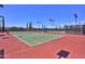 Beautiful outdoor tennis courts with pristine surfaces, well-maintained fencing, and ample lighting at 12942 W Sola Dr, Sun City West, AZ 85375