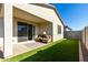 Private backyard with covered patio and artificial turf at 14627 W Valentine St, Surprise, AZ 85379