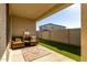 Relaxing backyard patio with artificial turf and seating at 14627 W Valentine St, Surprise, AZ 85379