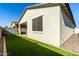 Home exterior and private backyard with artificial turf at 14627 W Valentine St, Surprise, AZ 85379