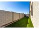 Artificial turf backyard surrounded by block wall at 14627 W Valentine St, Surprise, AZ 85379