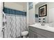 Clean bathroom with a shower/tub combo and gray vanity at 14627 W Valentine St, Surprise, AZ 85379