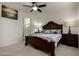 Bright bedroom with a queen-size bed and en-suite bathroom at 14627 W Valentine St, Surprise, AZ 85379