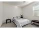 Bright bedroom with a double bed and window coverings at 14627 W Valentine St, Surprise, AZ 85379