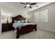 Spacious bedroom with a large bed and ceiling fan at 14627 W Valentine St, Surprise, AZ 85379