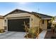 New construction home with a two-car garage and desert landscaping at 14627 W Valentine St, Surprise, AZ 85379