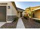 Front entry with walkway to a two-car garage at 14627 W Valentine St, Surprise, AZ 85379