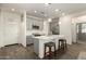 Modern kitchen with gray cabinets, white countertops, and stainless steel appliances at 14627 W Valentine St, Surprise, AZ 85379