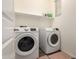 Laundry room with side-by-side washer and dryer at 14627 W Valentine St, Surprise, AZ 85379
