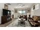 Bright living room features a cozy seating area and a fireplace at 14627 W Valentine St, Surprise, AZ 85379