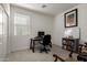 Home office featuring a desk, chair, and built-in shelving at 14627 W Valentine St, Surprise, AZ 85379