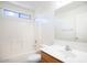 Clean bathroom featuring a tub shower and wood vanity at 1552 E Oak Rd, San Tan Valley, AZ 85140