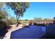 Landscaped backyard with hot tub and seating area at 1780 W Morse Dr, Anthem, AZ 85086