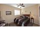 Guest bedroom with wood flooring and ceiling fan at 1780 W Morse Dr, Anthem, AZ 85086