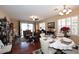 Bright dining area with hardwood floors and white table setting at 1780 W Morse Dr, Anthem, AZ 85086