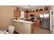 L-shaped kitchen with ample counter space and wood cabinets at 1780 W Morse Dr, Anthem, AZ 85086