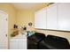 Laundry room with washer, dryer, and cabinets at 1780 W Morse Dr, Anthem, AZ 85086