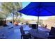 Outdoor patio with table, chairs, and umbrella at 1780 W Morse Dr, Anthem, AZ 85086