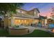 Two-story home with a backyard oasis, featuring a pool, fire pit, and pergola at 18456 E Superstition Dr, Queen Creek, AZ 85142
