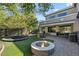 Landscaped backyard featuring a fire pit, trampoline, and patio area at 18456 E Superstition Dr, Queen Creek, AZ 85142