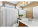 Clean bathroom with shower, single vanity, and updated fixtures at 18456 E Superstition Dr, Queen Creek, AZ 85142
