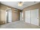 Bedroom with carpet, double doors and large closet at 18456 E Superstition Dr, Queen Creek, AZ 85142