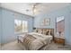 Spacious bedroom with large windows and ceiling fan at 18456 E Superstition Dr, Queen Creek, AZ 85142