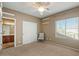 Bedroom with ceiling fan, large closet and view of bathroom at 18456 E Superstition Dr, Queen Creek, AZ 85142
