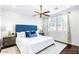 Bright bedroom featuring a plush bed, decorative pillows, and matching nightstands at 18456 E Superstition Dr, Queen Creek, AZ 85142