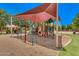 playground with shade structure and play equipment at 18456 E Superstition Dr, Queen Creek, AZ 85142