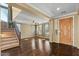Grand entryway with hardwood floors and a staircase at 18456 E Superstition Dr, Queen Creek, AZ 85142