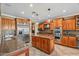 Spacious kitchen with granite countertops and stainless steel appliances at 18456 E Superstition Dr, Queen Creek, AZ 85142