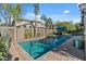 Refreshing pool with palm trees and ample space for lounging at 18456 E Superstition Dr, Queen Creek, AZ 85142