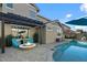 Relaxing pool area with a fire pit and comfortable seating at 18456 E Superstition Dr, Queen Creek, AZ 85142