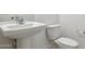 Clean and updated bathroom with pedestal sink at 25380 W Sunland Ave, Buckeye, AZ 85326