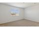 Simple bedroom with window and carpet at 25380 W Sunland Ave, Buckeye, AZ 85326
