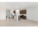 Open concept kitchen with stainless steel appliances and island at 25380 W Sunland Ave, Buckeye, AZ 85326